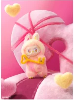 LOST collectible figure featuring LABUBU in a fluffy pink and yellow bunny costume, holding a heart-shaped key. Surrounded by playful pink yarn and soft heart-shaped clouds, this figure captures the essence of loyalty. The whimsical setting and adorable details make this piece a perfect addition to any collection