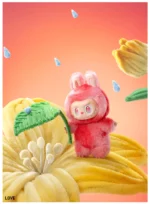 A cute LABUBU collectible figure wearing a fluffy pink bunny costume, holding a green leaf umbrella and standing on a large yellow flower. The vibrant colors and playful setup symbolize love and happiness, with raindrops adding to the whimsical atmosphere. Perfect for collectors, this joyful figure captures the essence of warmth and affection