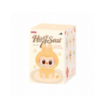 This image shows a box for the Have A Seat vinyl plush blind box series by Pop Mart. The box features the character Labubu, which is dressed in a soft, fluffy bunny outfit. The design includes light pastel colors with playful star and musical note elements. It highlights several available figures in the collection with small windows on the sides of the box showing the characters. The design evokes a whimsical and cute aesthetic typical of Pop Mart's "The Monsters" series